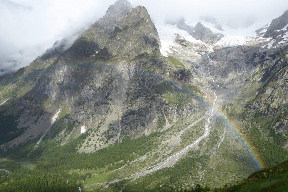 Rainbow in mountain valley