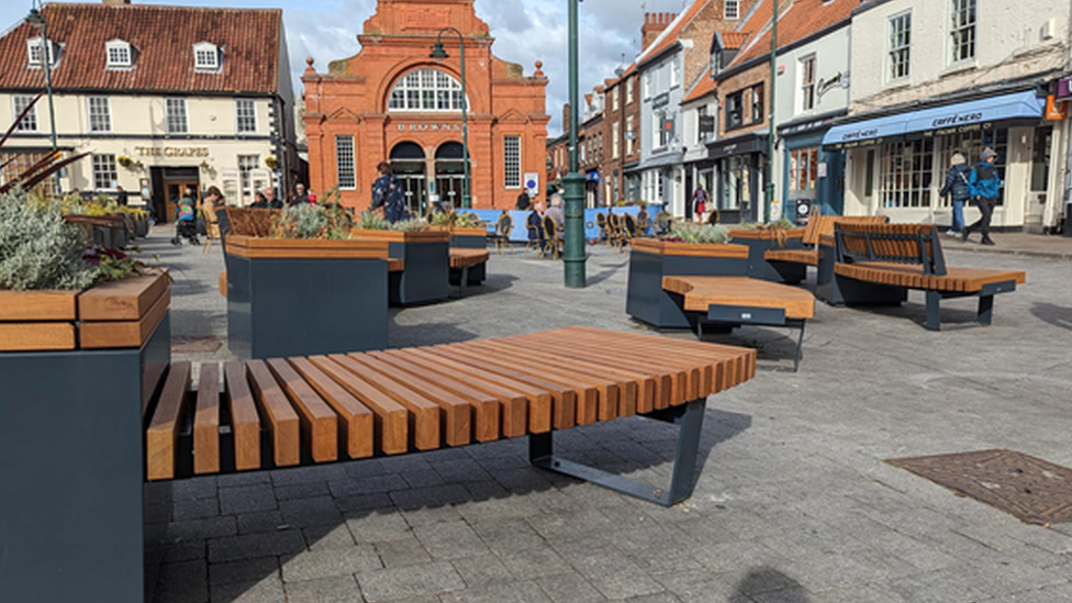 Seating installed in market area in Beverly