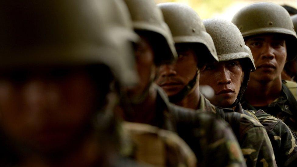 This photo taken on 31 March 2015 shows Philippine soldiers standing in formation at the provincial capital building turned into a military camp in Shariff Aguak, Maguindanao Province, Southern Philippines.