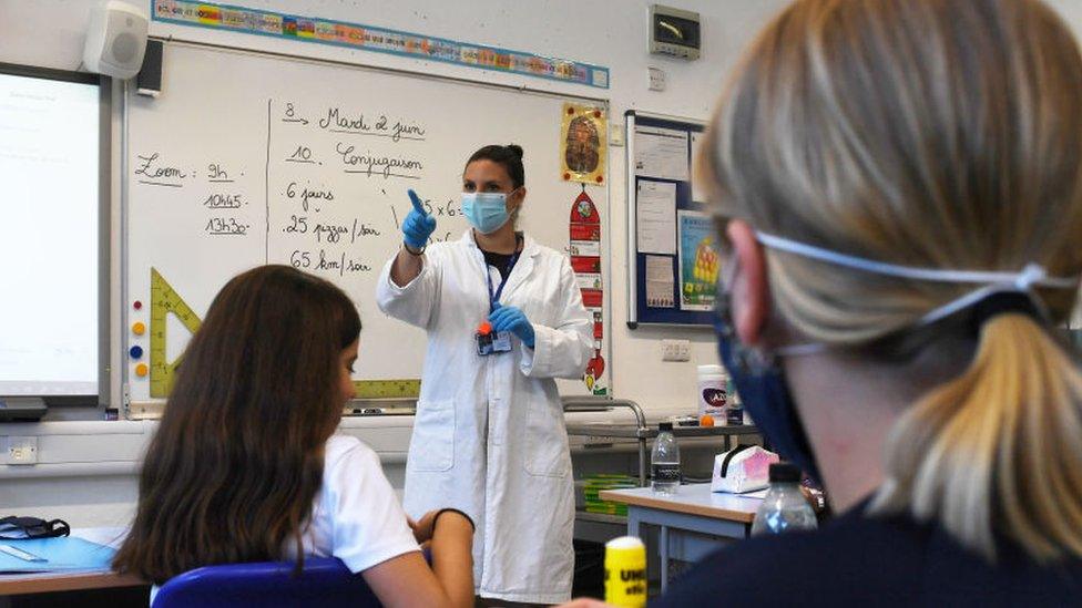 Science teacher leading a class