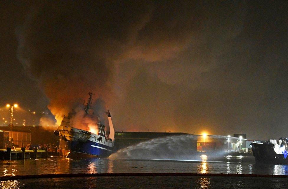 The Russian fishing trawler Bukhta Nayezdnik burns in the harbour of Tromso, Norway September 26, 2019.