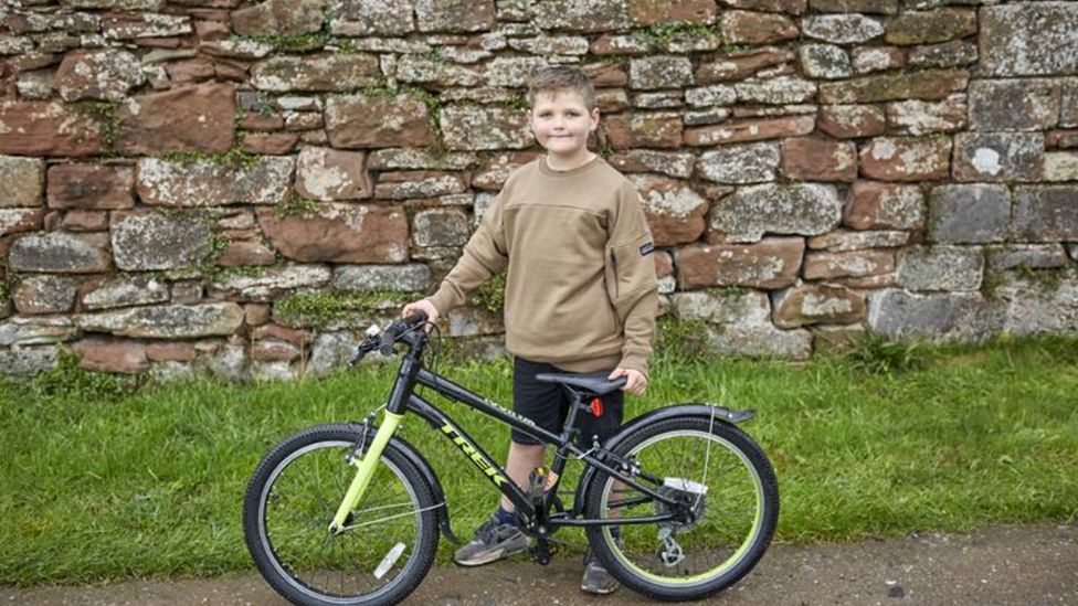 Tommy with his bike