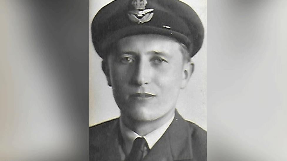 A photo of Patrick in RAF uniform, complete with cap, jacket, shirt and tie.