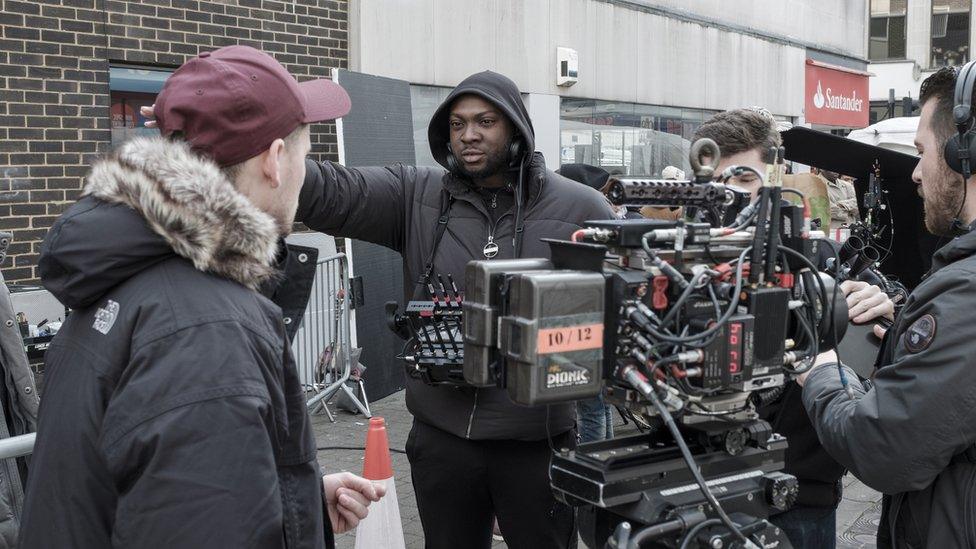 Rapman (centre) on the set of Blue Story