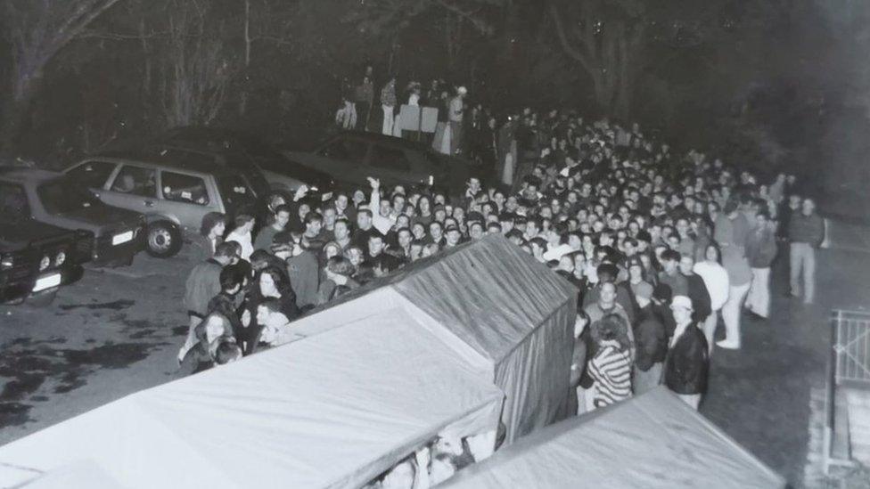 Queue of people waiting to enter the club