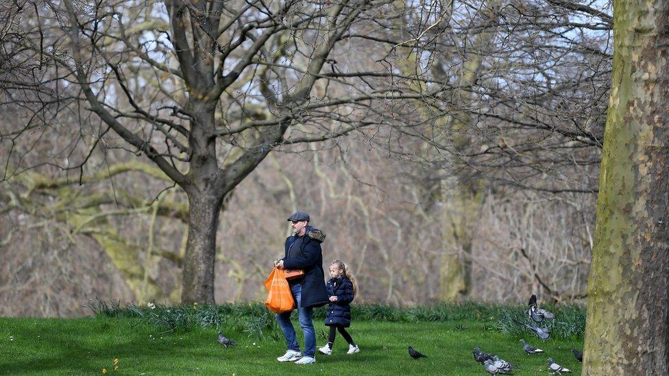 Members of the Public walk round St James"s Park on March 21, 2020 in London, England