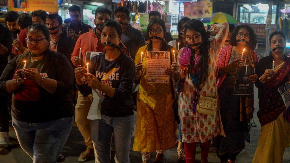 members of an NGO protest in Siliguri