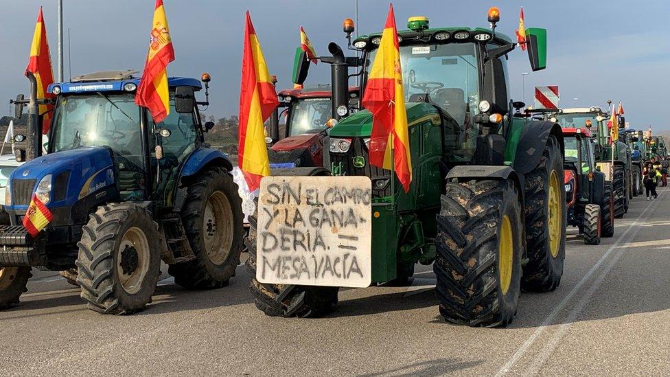 A convoy of tractors