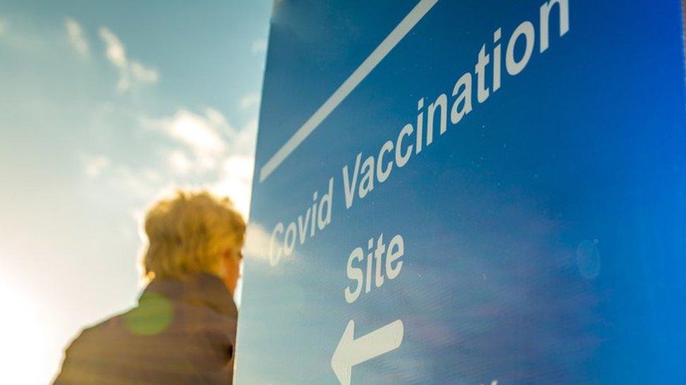 Man walking into Covid vaccination centre