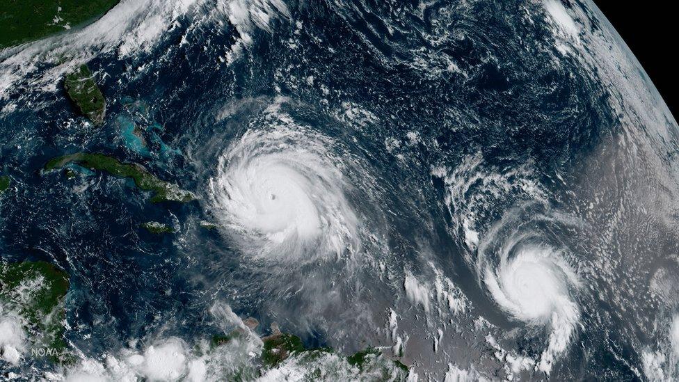 A satellite image shows Hurricane Irma (left) and Hurricane Jose (right) in the Atlantic Ocean, 7 September 2017