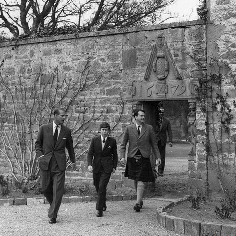 A young Prince Charles arrives for his first term at Gordonstoun school in Moray, accompanied by Prince Philip