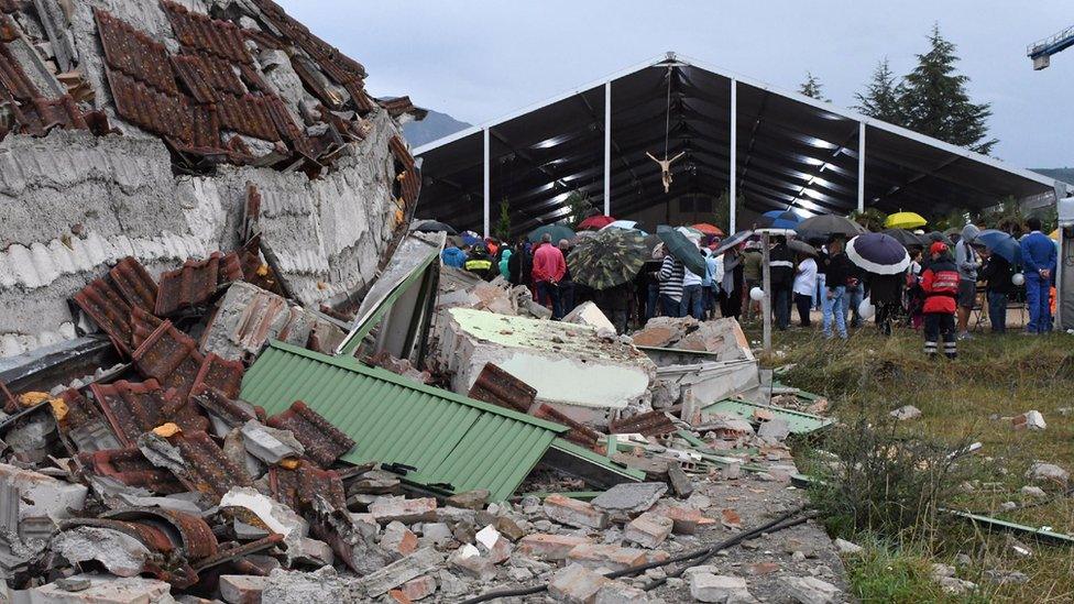 Debris next to the marquee hosting a state funeral for victims of earthquake in Amatrice, central Italy, Tuesday, Aug. 30, 2016