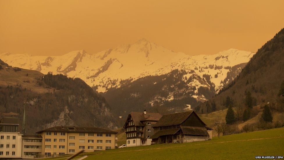 saharan dust cloud in mountains of switzerland