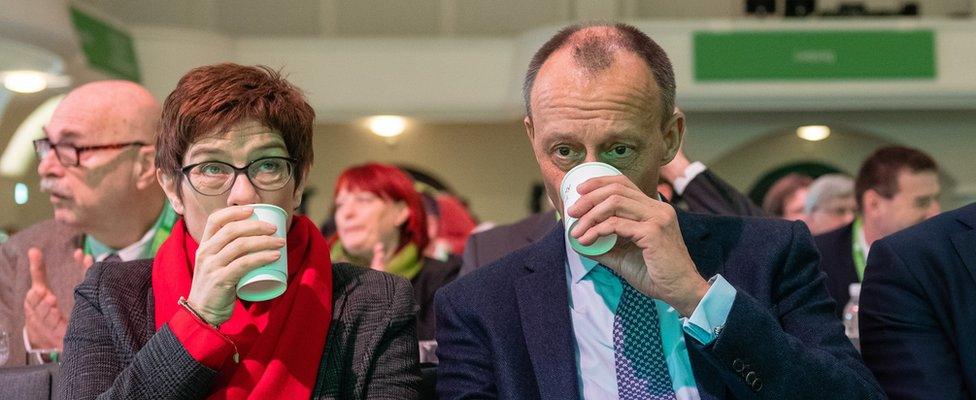 Annegret Kramp-Karrenbauer (L) and Friedrich Merz (R)