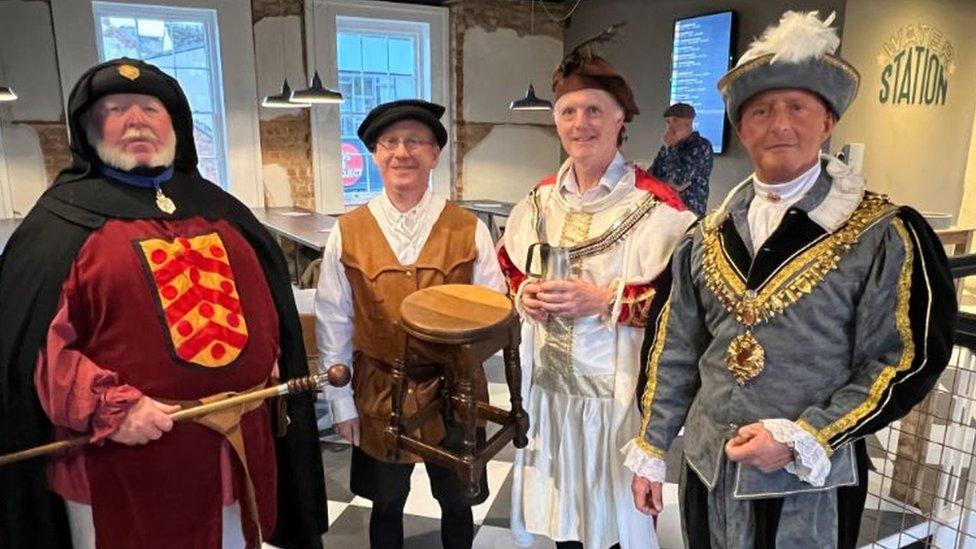 Gloucester town crier Alan Myatt, ale conner Jim Jenkins and Paul James City Guardian and sheriff councillor Justin Hudson