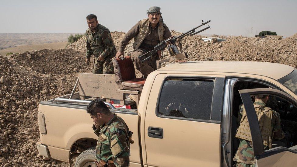 Kurdish Peshmerga fighters fortify positions on the frontline outside the town of Altun Kubri, Iraq, on 23 October 2017