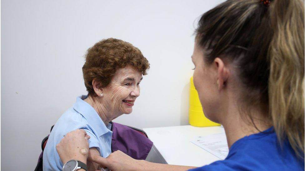 Pamela Rawson speaks with nurses Emma McCallum ahead of receiving the COVID-19 AstraZeneca vaccine