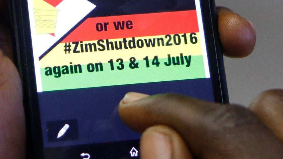 A man reading a message to shutdown Zimbabwe