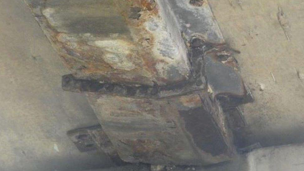 A picture showing a corroded bridge