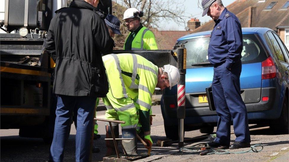 Forensic officers investigate the drains near the scene in South Park Crescent in Hither Green