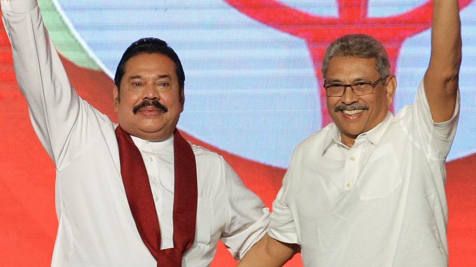 Sri Lankan opposition leader and former president Mahinda Rajapaksa (L) and former defence secretary Gotabaya Rajapaksa