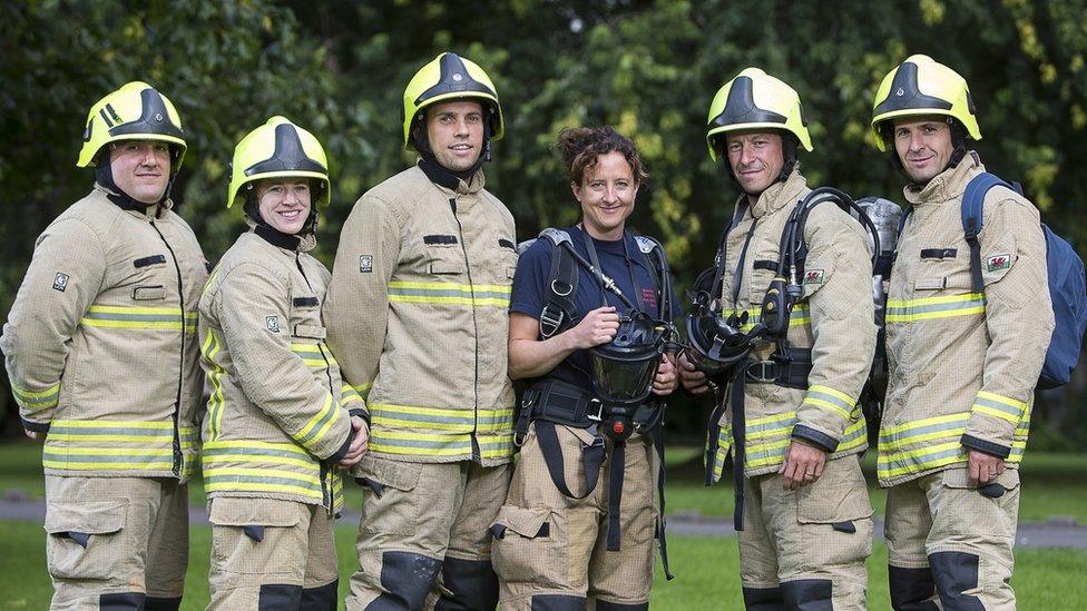 A photo of Kevin Summerhayes with his colleagues in full firefighting gear