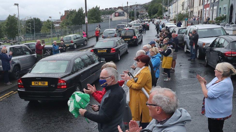 Members of the public lined the streets and clapped as John Hume's funeral cortege passed through the city.