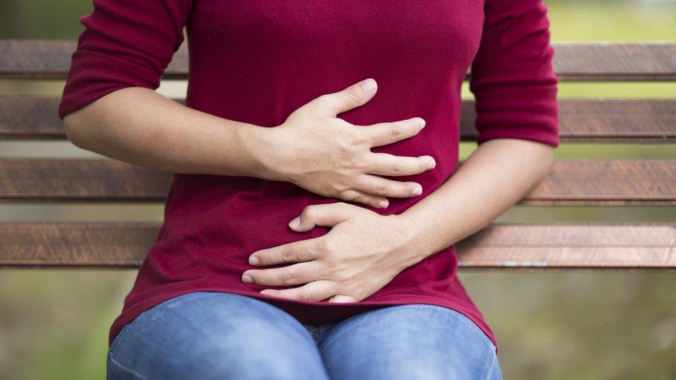 Woman with stomach pain