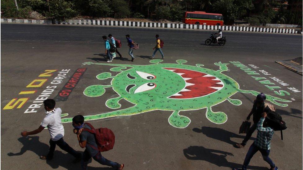 A coronavirus illustration drawn on a street