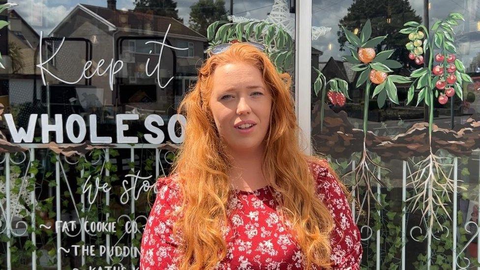 Jess Reed standing in front of her shop