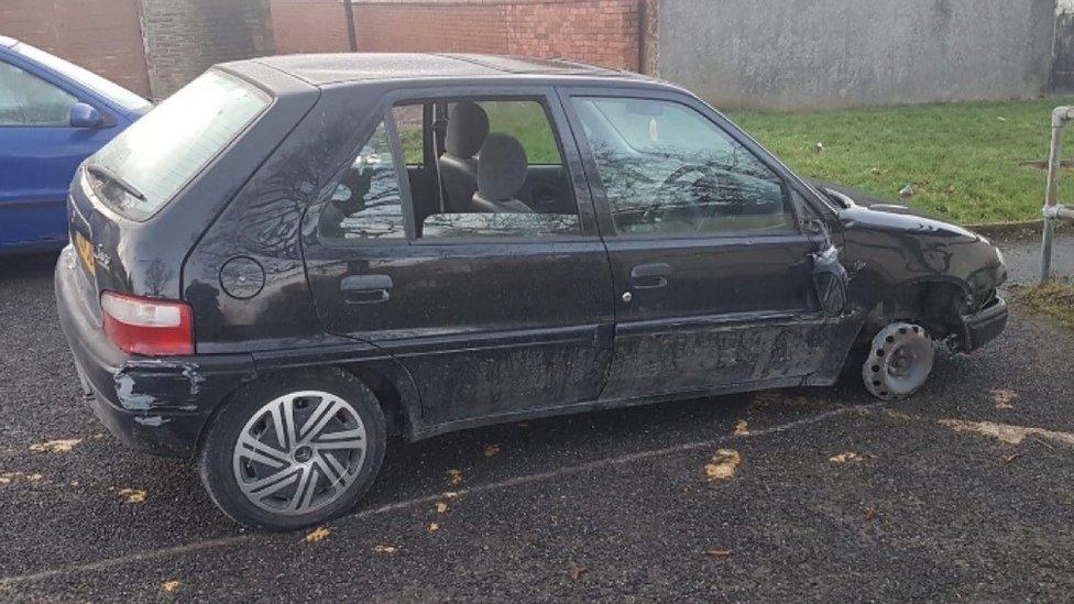 Citroen Saxo car without front wheel