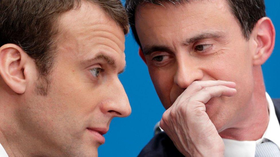 French Prime Minister Manuel Valls (right) speaking with former French Economy minister Emmanuel Macron in April 2015