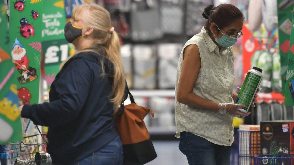 Shoppers wearing masks