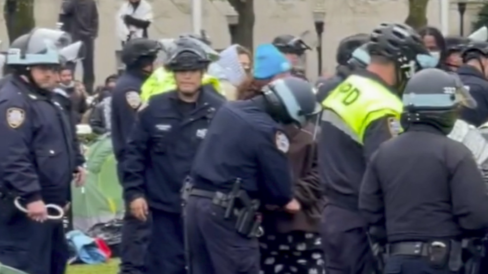 Police clear the camp on Wednesday