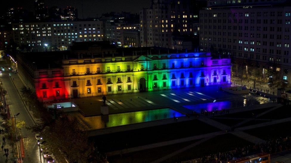 A handout photo made available by the Presidency of Chile shows Chilean President Michelle Bachelet (C) as she presents a bill she signed today to guarantee marriage equality, at La Moneda Palace in Santiago, Chile, 28 August 2017