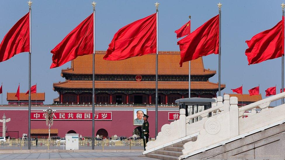 Forbidden City with the Chinese flag in front