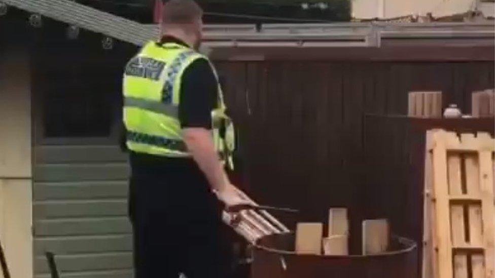 A police officer in an altercation with a man