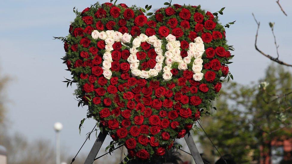 A floral tribute to Tom Parker, with his name spelled out in flowers in the middle of a heart shape