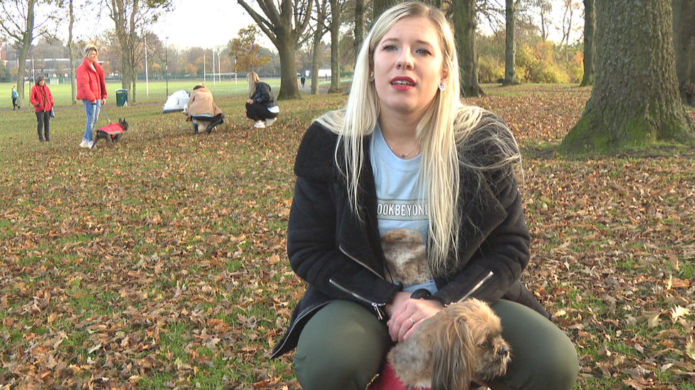 Pauline Majerowska in a park with dogs and owners in background