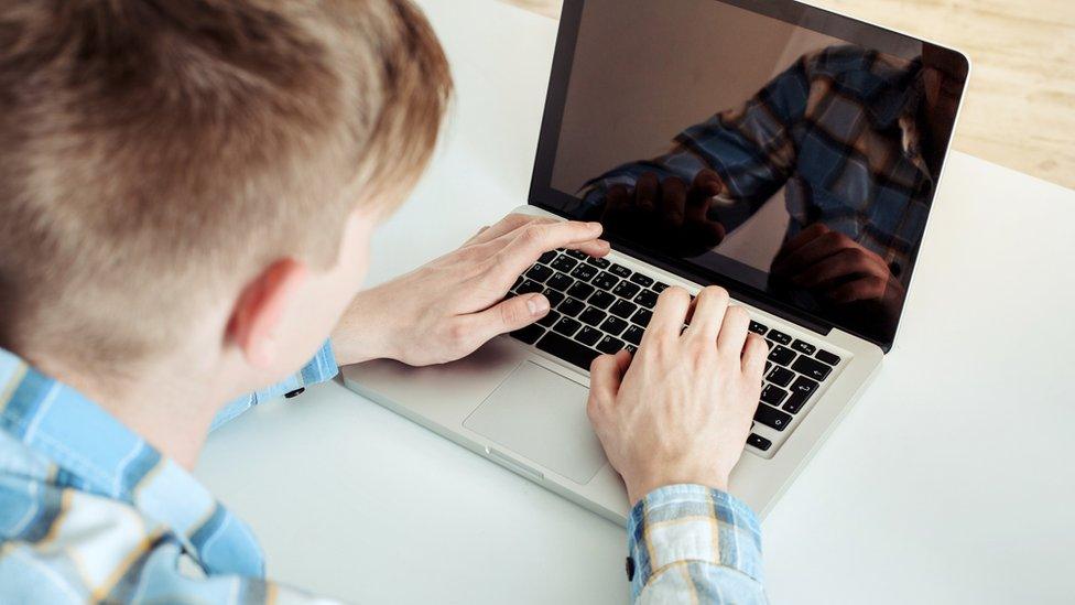 Teenager on computer