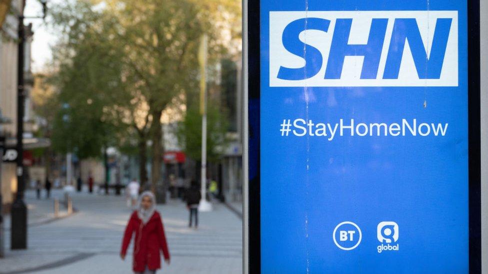 NHS-sign-encouraging-people-to-stay-at-home-in-Cardiff-city-centre.