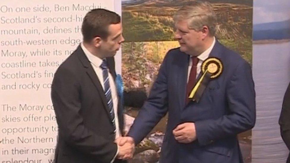 Angus Robertson (right) loses his seat to Douglas Ross