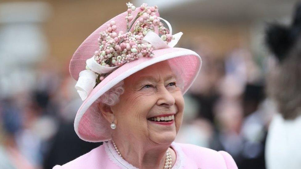 Queen Elizabeth II meeting guests during a Royal Garden Party at Buckingham Palace in London