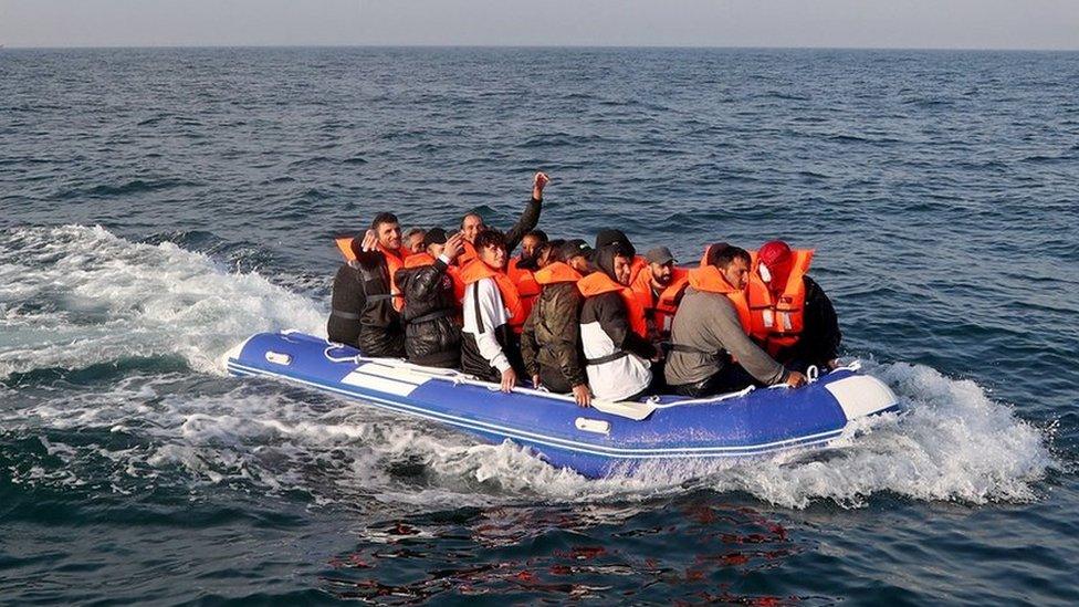 A group of people thought to be migrants crossing the Channel in a small boat headed in the direction of Dover, Kent.