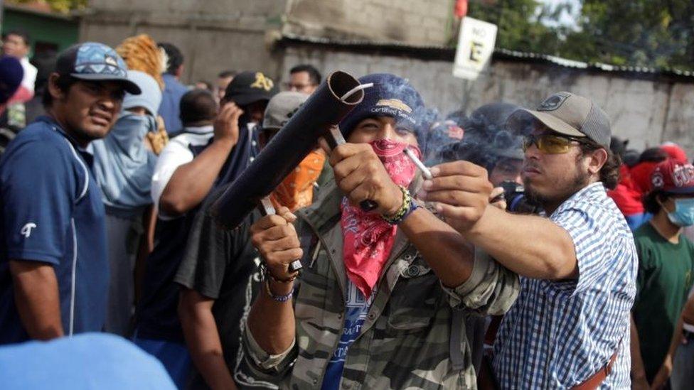 Demonstrators fire a homemade mortar in Masaya, Nicaragua, June 18, 2018.