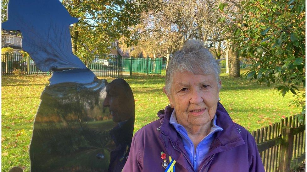 Irene Sinclair, Chair of the Chippenham branch, of the Royal British Legion standing next to the repaired Tommy