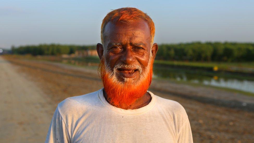 50-year-old cattle rancher Tajul Haq with his henna dyed beard