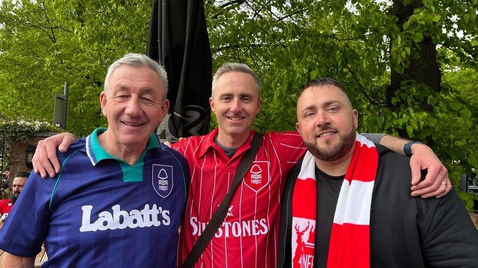 Neil (centre), his dad and a friend