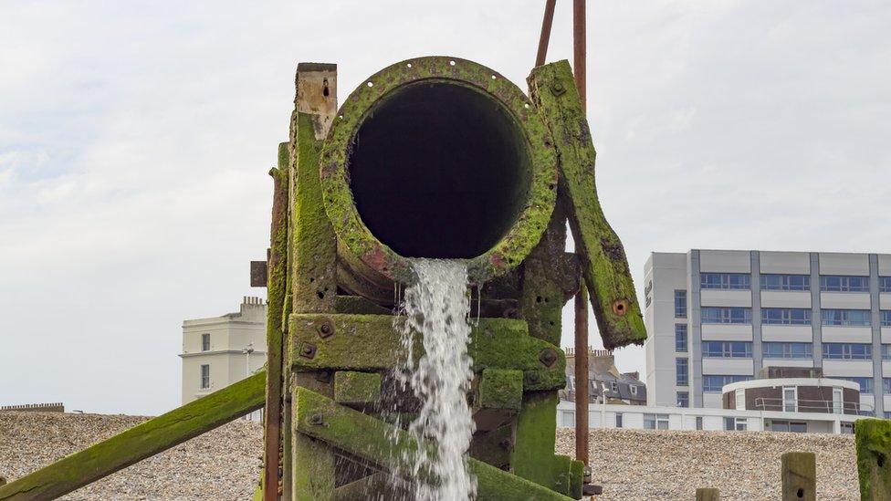 Sewage pipe on beach