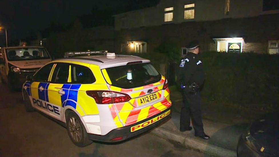 A policeman stands watch outside the property on Swinburne Road